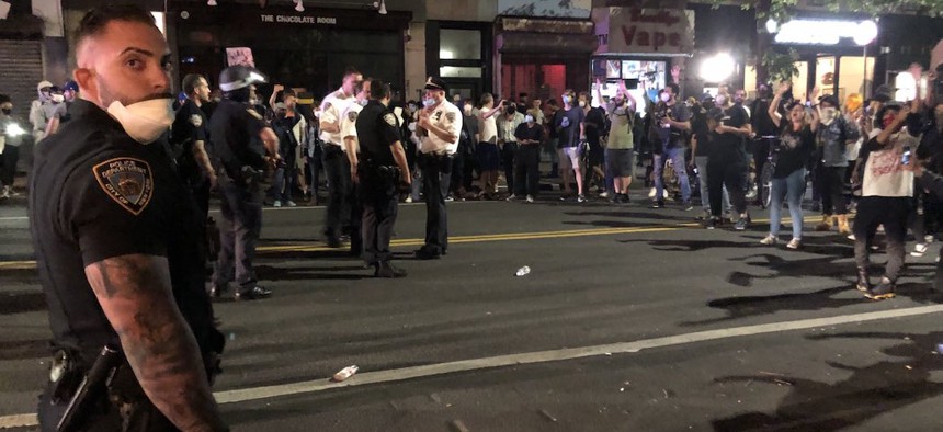 Protesters demonstrating the death of George Floyd faceoff against the NYPD on May 29th in Park Slope.