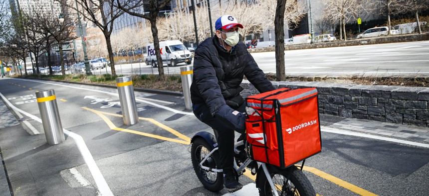 A bike delivery worker in NYC in March of this year.