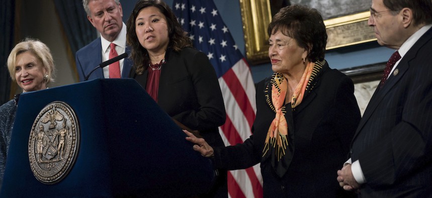 Representative Grace Meng (center) at a press conference in 2017.