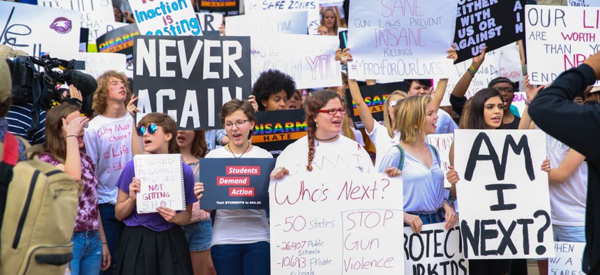 Huge crowd participated at "Never Again" rally to protest and change gun laws after the shooting at Marjory Stoneman Douglas High School.