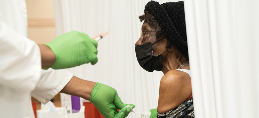 A woman gets vaccinated at Abyssinian Baptist Church in Harlem.