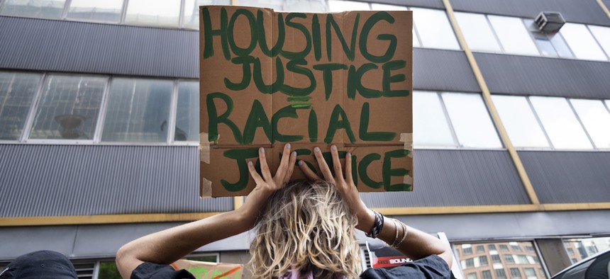 People participate in a protest calling on New York to cancel rent outside of a New York Civil Court in Brooklyn on Tuesday, July 7th.