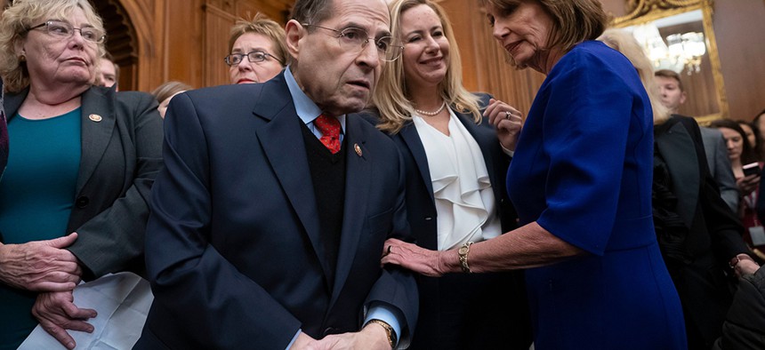 Speaker of the House Nancy Pelosi, right, speaks with New York Rep. Jerrold Nadler, chairman of the House Judiciary Committee, as she unveils a comprehensive elections and ethics reform package in early January.