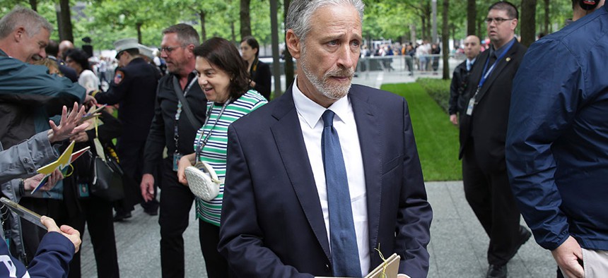 John Stewart attending a dedication ceremony for the new memorial glade at ground zero, for those who became sick or died after responding to the 9/11 attacks, in May.