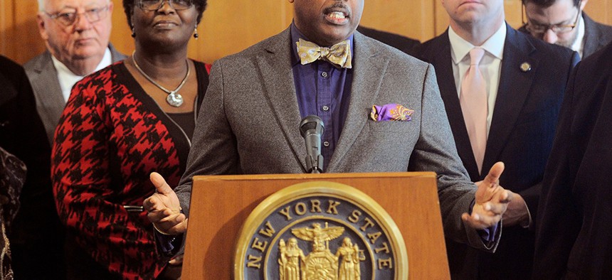 New York Senator Kevin Parker stands with Senate members during a press conference