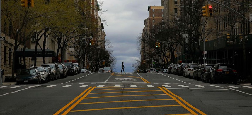 A person crosses a trafficless West End Avenue on April 10th.