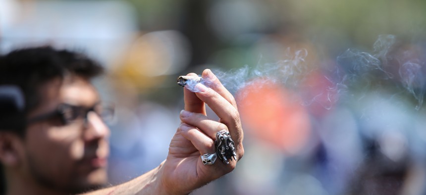 A New Yorker holding a joint during the Cannabis Parade.