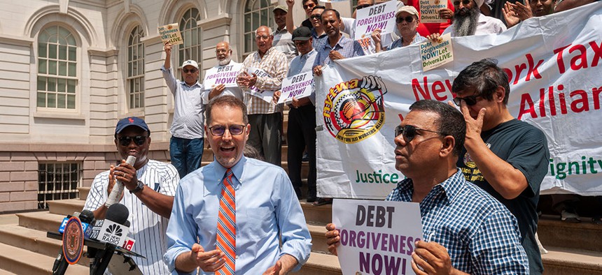 NYC Council Member Mark Levine speaks at a press conference with taxi drivers on the steps of NY City Hall calling for debt forgiveness for their medallions, July 11.