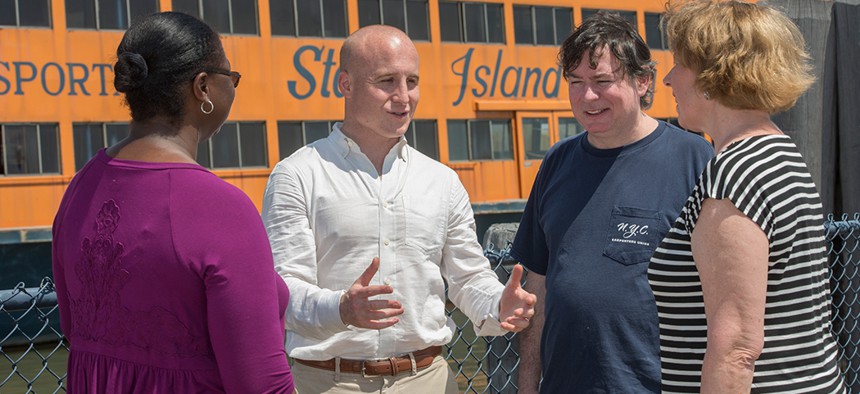 Max Rose speaks with constituents.