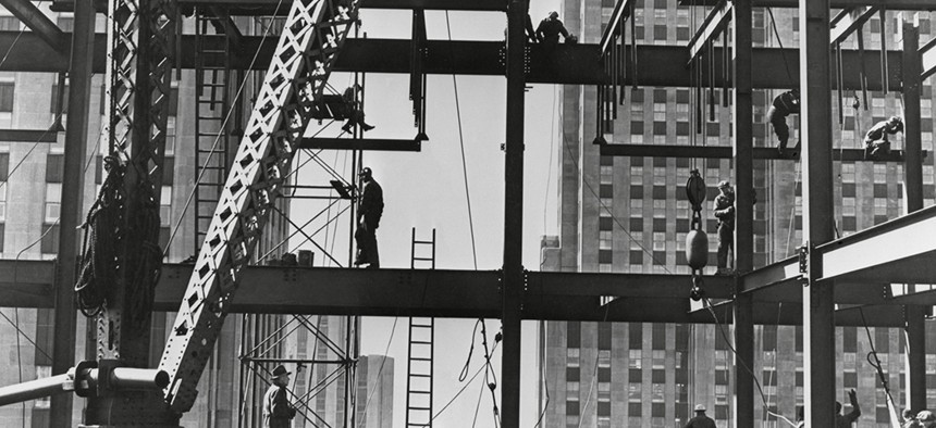 Iron workers raise steel at 32nd floor of the Esso Building in New York City in 1954.