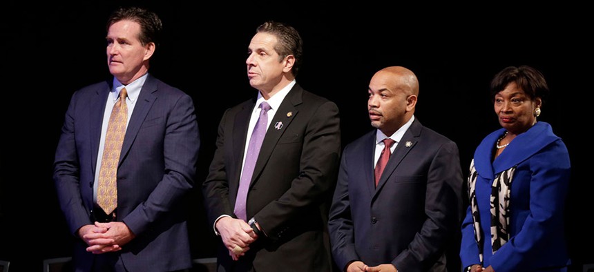 Former senate majority leader John Flanagan, New York Gov. Andrew Cuomo, Assembly Speaker Carl Heastie, and Senate Majority Leader Andrea Stewart-Cousins.