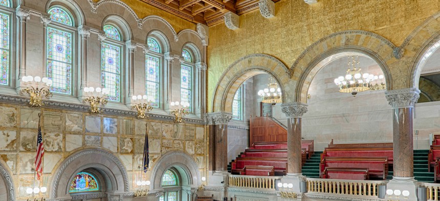 An empty New York State Senate chamber.