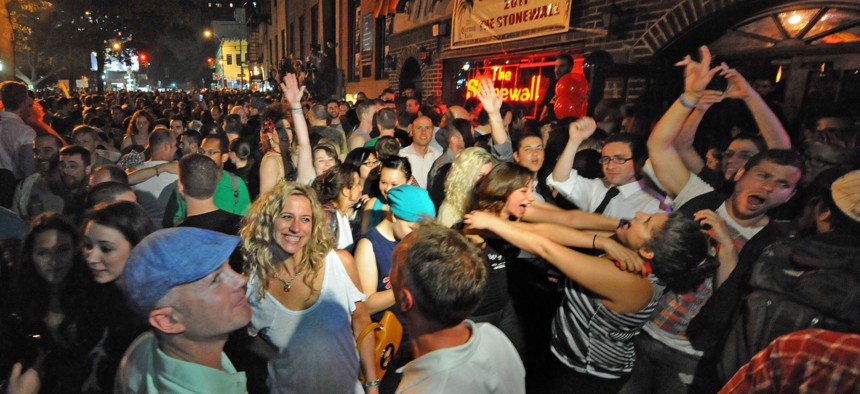 People celebrate the legalization of same-sex marriage in New York outside of Stonewall Inn in Manhattan, where the gay rights movement is considered to have started in 1969.