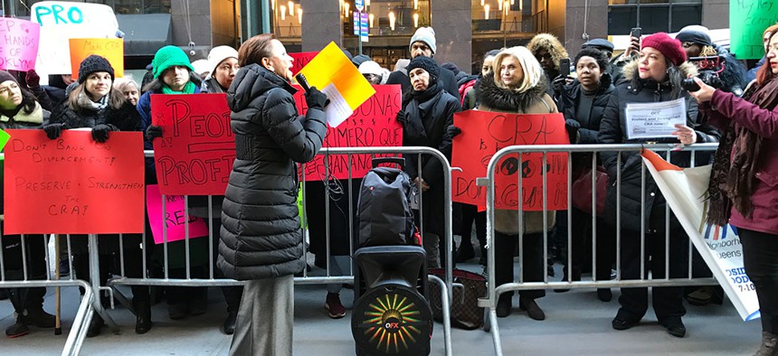 Reps. Nydia Velazquez and Carolyn Maloney participate in the protest against plans to revise the Community Reinvestment Act of 1977.