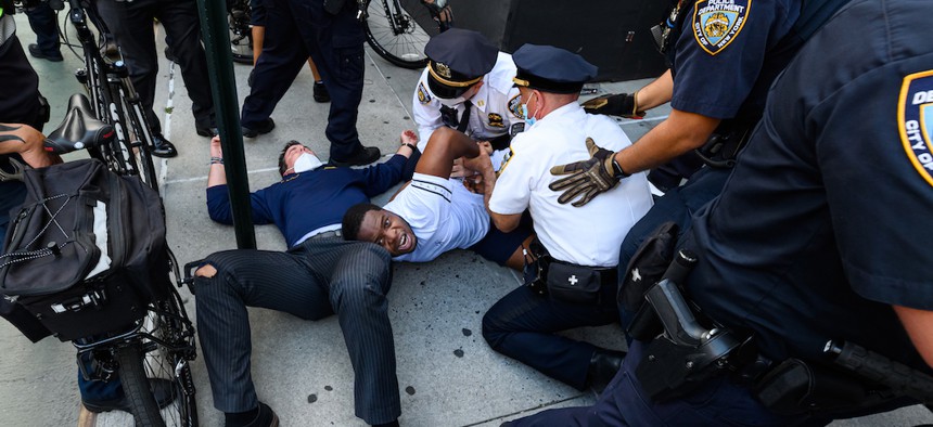 NYPD officers arrest a protester in Union Square during a rally responding to the death of Minneapolis man George Floyd at the hands of police.