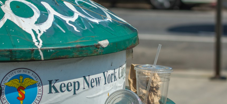 Trashcan with sign "Keep New York Clean" on a street of Manhattan. 