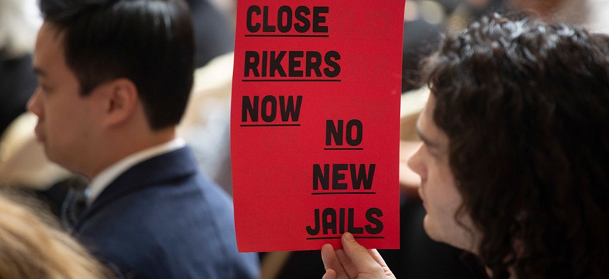 A protestor at a NYC Council hearing.