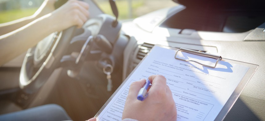 A person takes a test to obtain a driver's license.