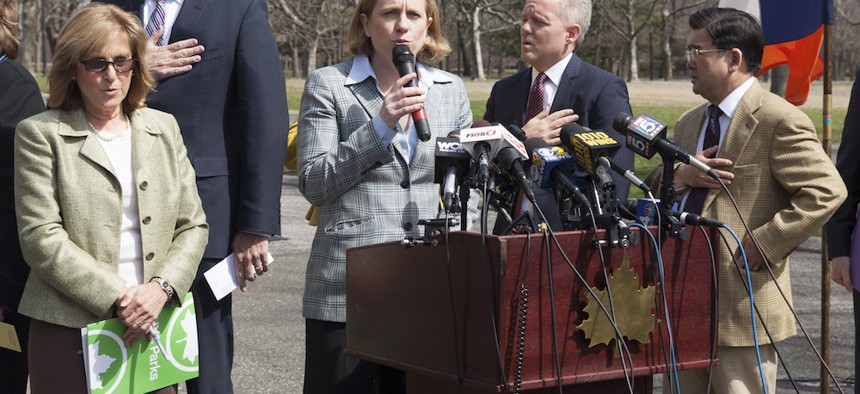 Rep. Joe Crowley, Queens Borough President Melinda Katz, City Councilman Jimmy Van Bramer and more sing the national anthem to celebrate 50th anniversary of World's Fair in Queens Flushing Meadows Park in 2014.