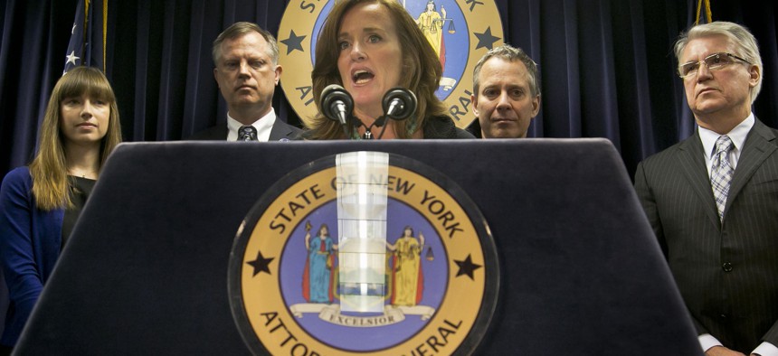 Then-Nassau County District Attorney Kathleen Rice speaks at a press conference hosted by Eric Schneiderman in 2013.