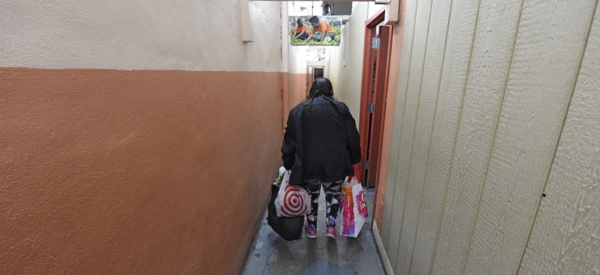 A client exits a Brooklyn-based food bank. 