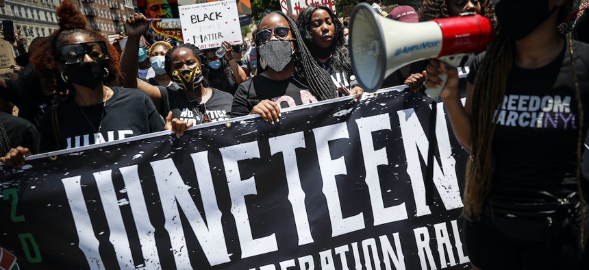 Protesters chant as they march after a Juneteenth rally at the Brooklyn Museum on June 19, 2020.