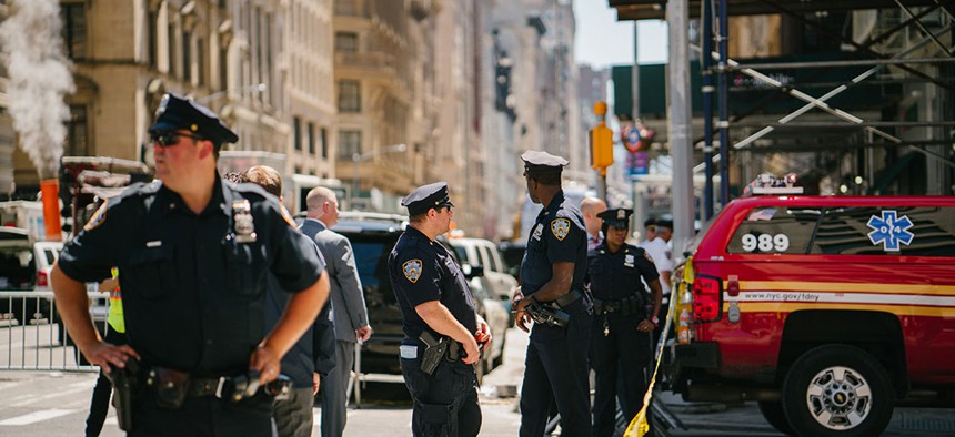 Police stand near the steam pipe explosion that occurred in New York City's Flatiron district, July, 2018.