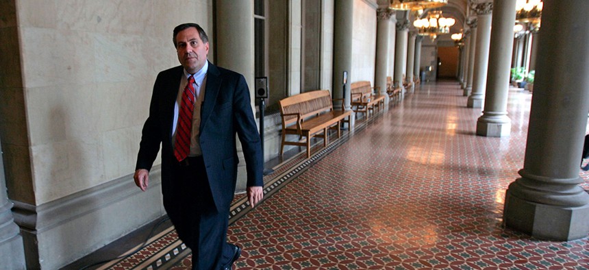 Steve Pigeon walks in a hallway at the Capitol in Albany, N.Y