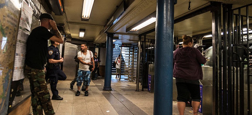 Police minding the subway entrance.