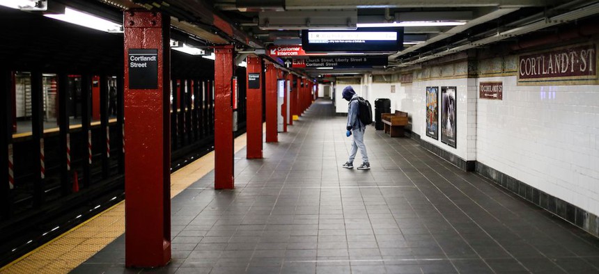 A lone subway customer wears protective gloves on March 21st.