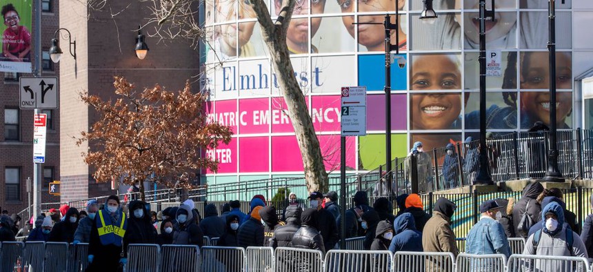 People line up outside Elmhurst Hospital Center in Queens to be tested for the coronavirus.