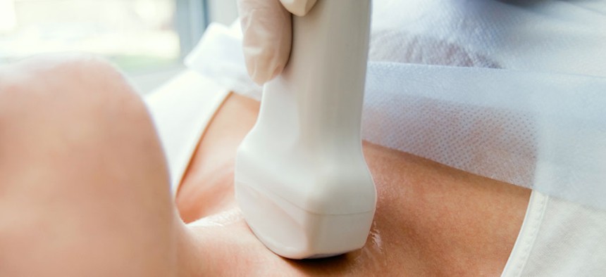 A patient being screened for thyroid cancer.