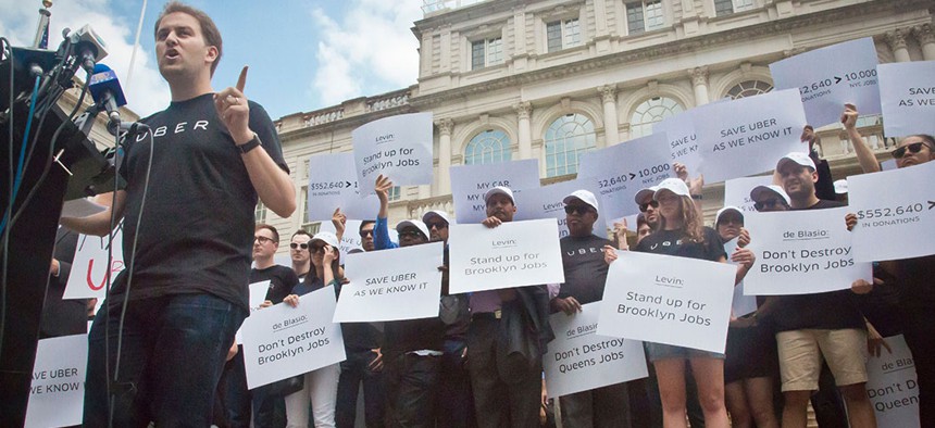 Josh Mohrer, then Uber's New York manager, led a rally in front of City Hall in 2015 while the council considered a cap on for-hire vehicles.