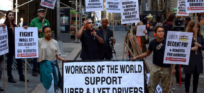 Uber and Lyft drivers protest outside the New York Stock Exchange on May 8.