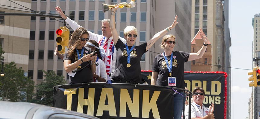 Carli Lloyd, Megan Rapinoe, Jill Ellis and Bill de Blasio at the 2015 ticker tape parade in New York City, to celebrate the U.S. women's soccer team's World Cup win.