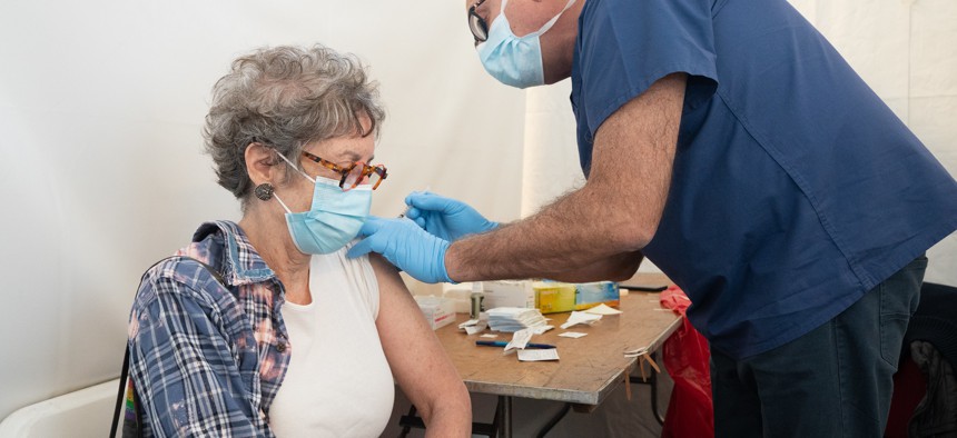 A woman gets vaccinated at Calvary Baptist Church in White Plains.