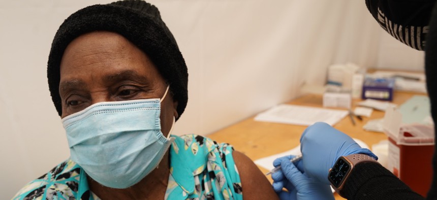 A woman receives the vaccine at the New York State Vaccination Site in the Bronx. 