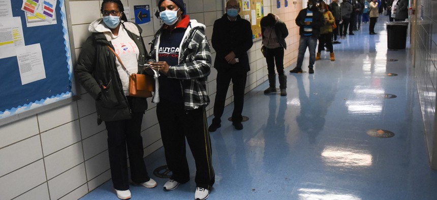 New Yorkers line up at a polling site in South Ozone Park in Queens.