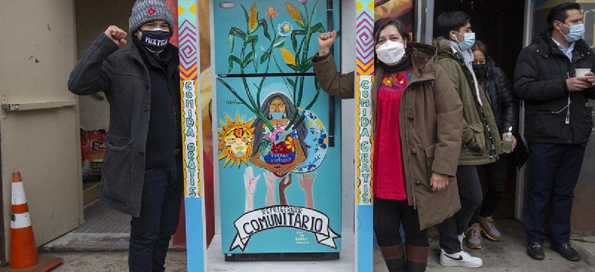 Council Member Menchaca & others at a community fridge