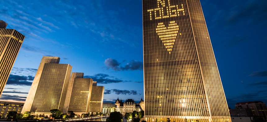 Buildings in Albany lit up with the words "NY Tough"