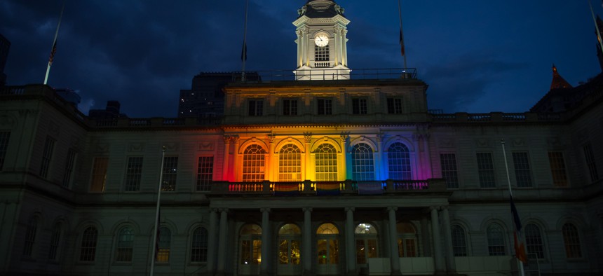 New York City Hall lit up for pride.