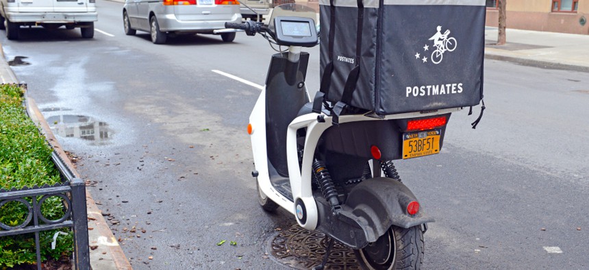 A Postmates delivery vehicle on the streets of New York City.