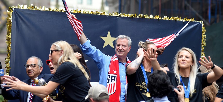 New York City Mayor with the U.S. national soccer team at the ticker tape parade celebrating their World Cup victory.