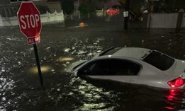 A car that was underwater in Jamaica due to the severe flooding on Wednesday.