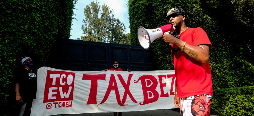 Former Amazon employee Chris Smalls protesting outside of Jeff Bezos' mansion.