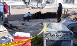 NY Department of Buildings staff inspects the house where people were killed when their basement apartment was flooded during Hurricane Ida.