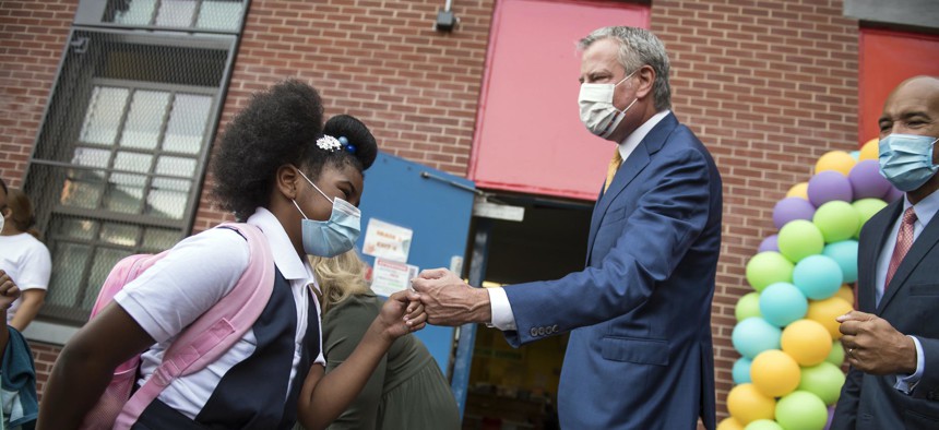 Mayor de Blasio welcoming students back to school at P.S. 25 in the Bronx.