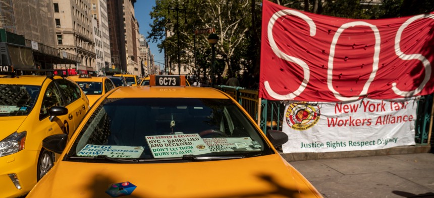 Taxis parked in protest at New York City Hall.