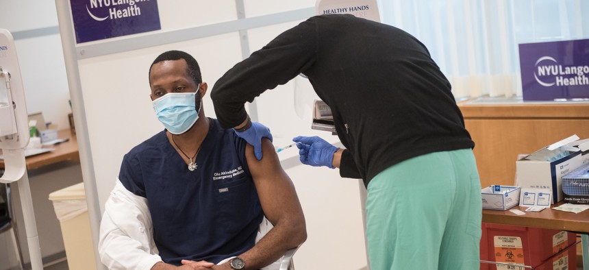 A healthcare worker receiving the vaccine at NYU Langone.