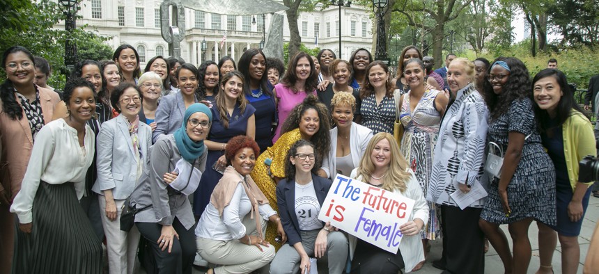 Female council members and others gathered at a 21 in '21 press conference.